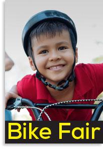 Image of child wearing a helmet on a Bike