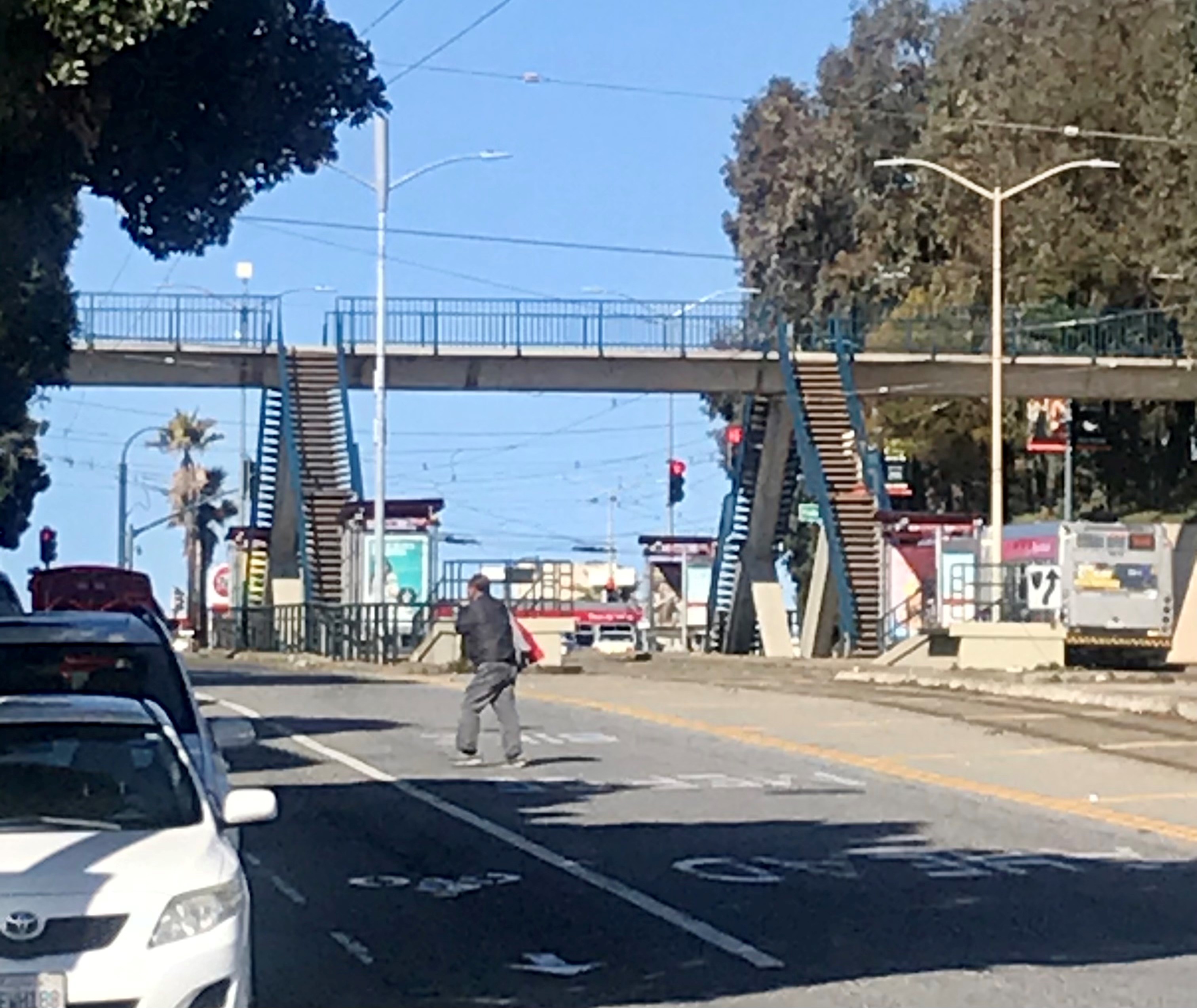 Pedestrian crossing mid-block safely in San Francisco