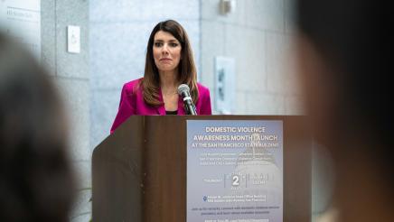 Asm. Stefani speaking DV Awareness Event Photo